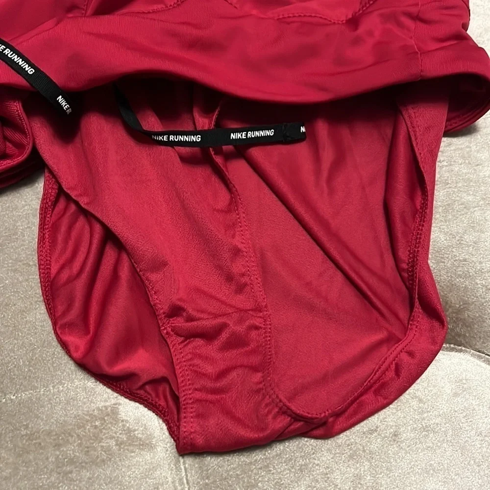 Nike raspberry colored Dri-Fit running shorts, medium, new